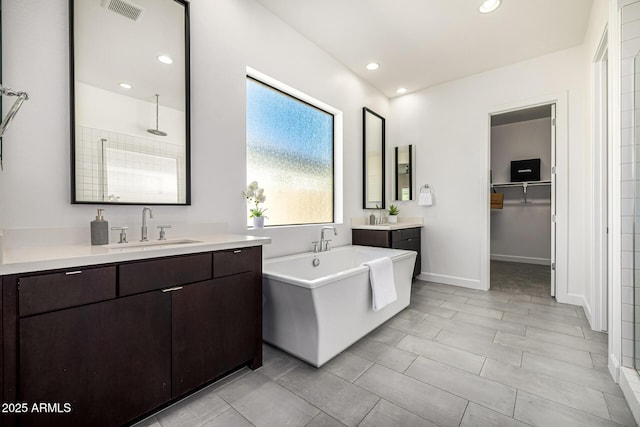 3822 E Canyon Pl, Chandler, AZ 85249 - full bath with a tile shower, two vanities, a freestanding tub, recessed lighting, and a spacious closet