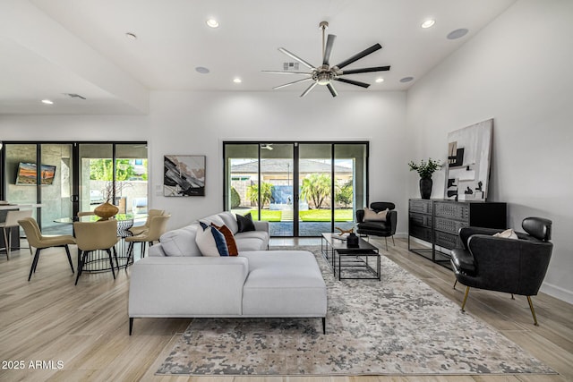 3822 E Canyon Pl, Chandler, AZ 85249 - living area featuring a ceiling fan, light wood finished floors, recessed lighting, and a high ceiling