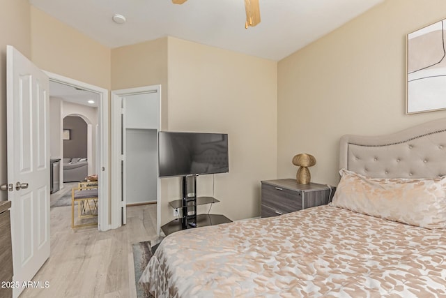 84 E Joseph Way, Gilbert, AZ 85295 - bedroom featuring arched walkways, wood finished floors, and a ceiling fan
