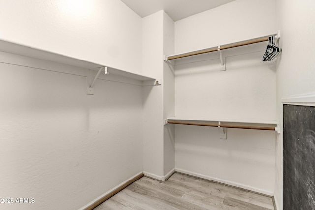 84 E Joseph Way, Gilbert, AZ 85295 - walk in closet with light wood finished floors