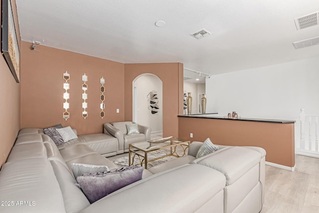 84 E Joseph Way, Gilbert, AZ 85295 - living room with light wood-type flooring, arched walkways, and track lighting