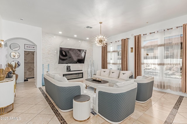 84 E Joseph Way, Gilbert, AZ 85295 - living room with inlaid floor details, arched walkways, light tile patterned floors, a chandelier, and recessed lighting