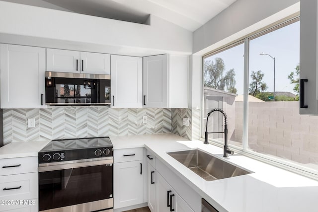 5125 W Wickiup Ln, Glendale, AZ 85308 - kitchen with stainless steel appliances, a sink, light countertops, and white cabinets