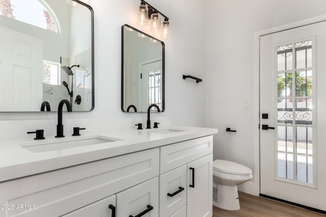 5125 W Wickiup Ln, Glendale, AZ 85308 - full bath featuring toilet, double vanity, wood finished floors, and a shower