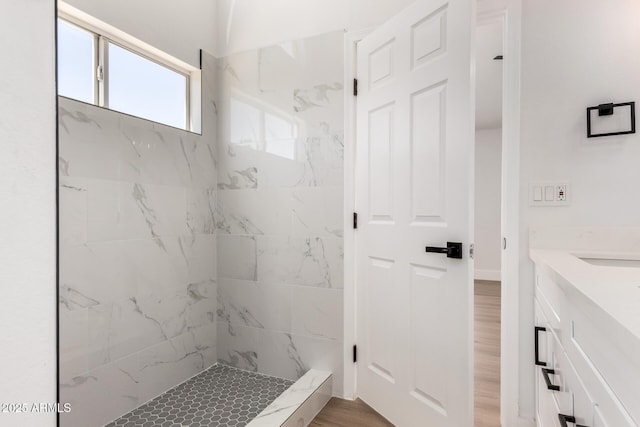 5125 W Wickiup Ln, Glendale, AZ 85308 - full bathroom with vanity, a marble finish shower, and wood finished floors