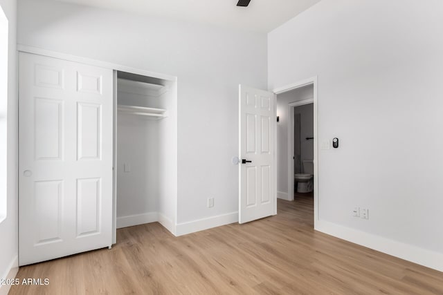 5125 W Wickiup Ln, Glendale, AZ 85308 - unfurnished bedroom with light wood-style floors, baseboards, and a closet