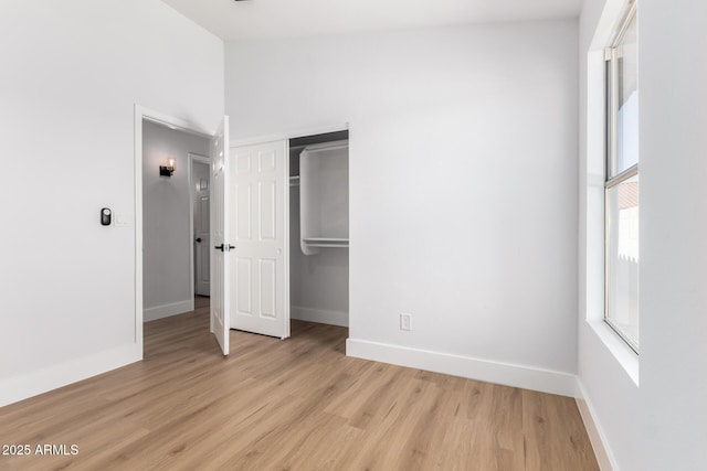 5125 W Wickiup Ln, Glendale, AZ 85308 - unfurnished bedroom with light wood-type flooring, baseboards, and a closet