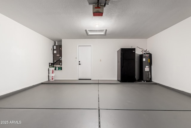 5125 W Wickiup Ln, Glendale, AZ 85308 - garage featuring freestanding refrigerator, water heater, a garage door opener, and baseboards