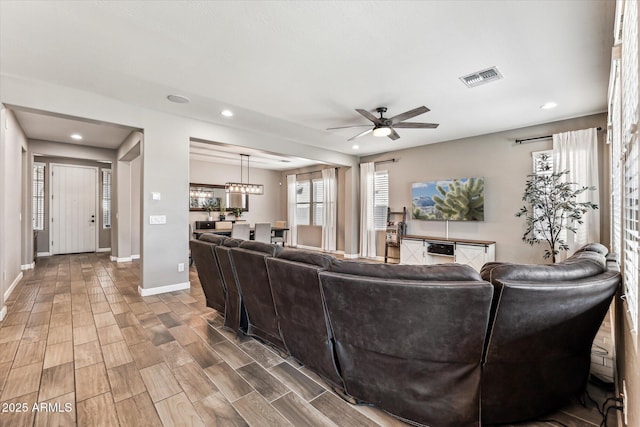 living room featuring ceiling fan, recessed lighting, wood finished floors, visible vents, and baseboards