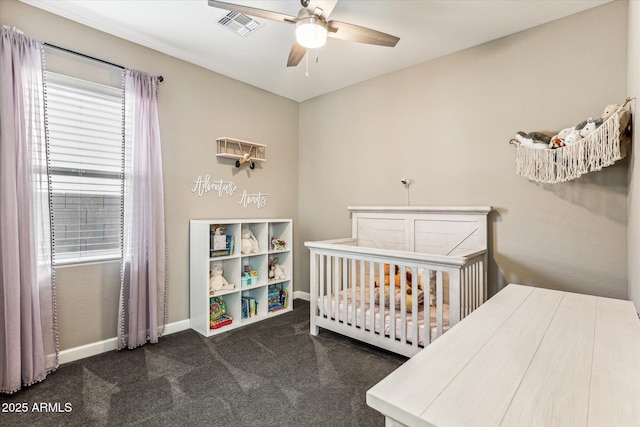 bedroom featuring ceiling fan, carpet floors, visible vents, baseboards, and a nursery area