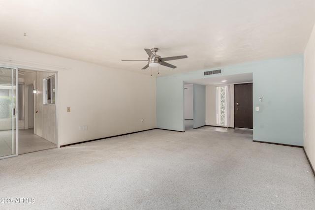 empty room featuring visible vents and ceiling fan