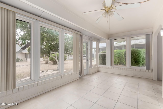 unfurnished sunroom with a healthy amount of sunlight and ceiling fan