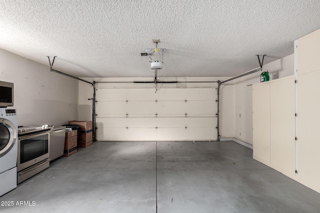 garage featuring washer / dryer and a garage door opener