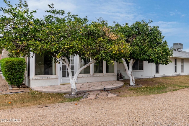 view of property hidden behind natural elements