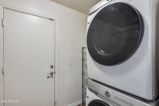 washroom with laundry area and stacked washing maching and dryer