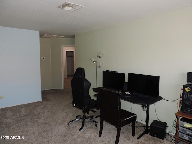 office with visible vents and carpet floors