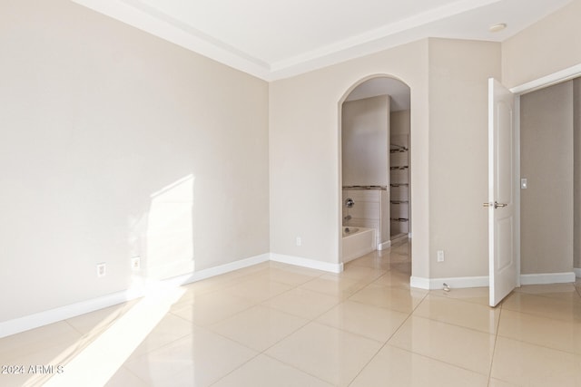 empty room with light tile patterned flooring