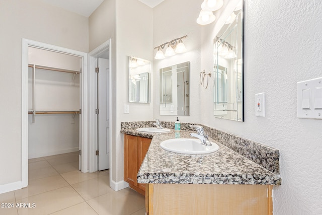 bathroom with tile patterned flooring and vanity