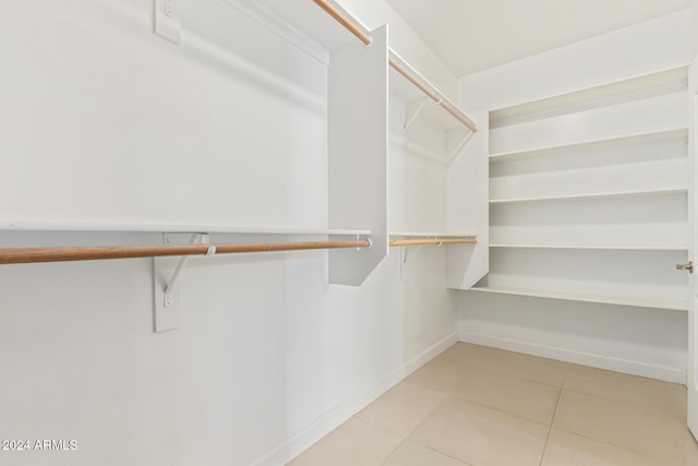 spacious closet featuring tile patterned floors