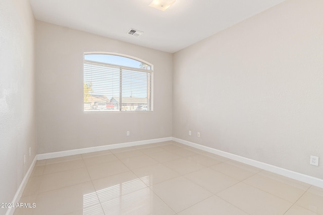 spare room featuring light tile patterned floors