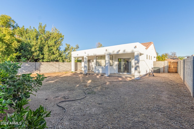 back of property with central air condition unit