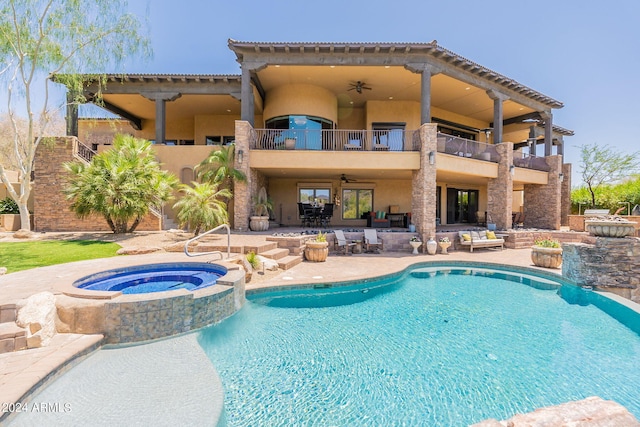 view of swimming pool featuring ceiling fan, an in ground hot tub, and a patio area