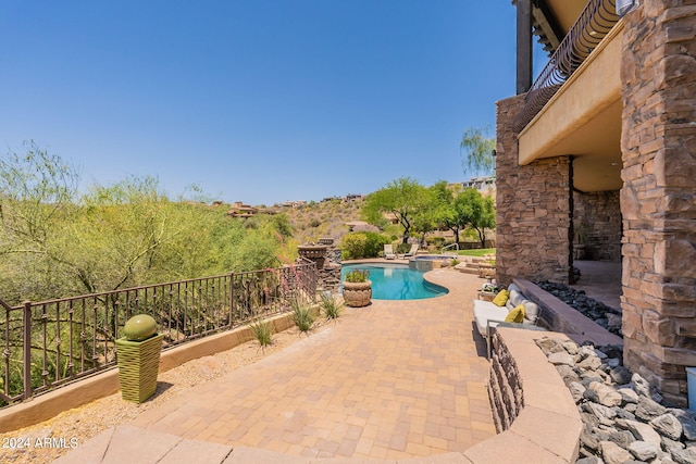 view of swimming pool featuring a patio