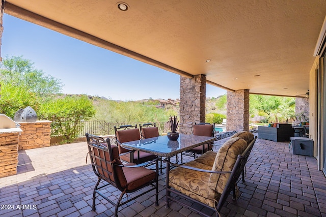 view of patio with outdoor lounge area and area for grilling