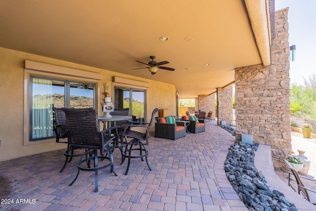 view of patio / terrace featuring ceiling fan and an outdoor hangout area