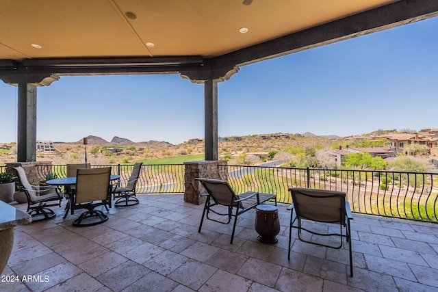 view of patio / terrace with a mountain view