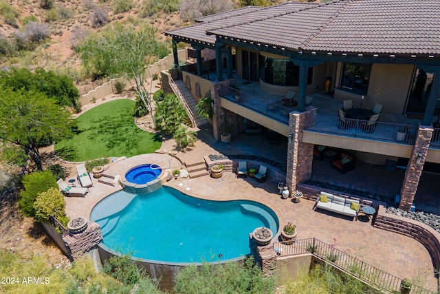 view of swimming pool with an in ground hot tub and a patio area