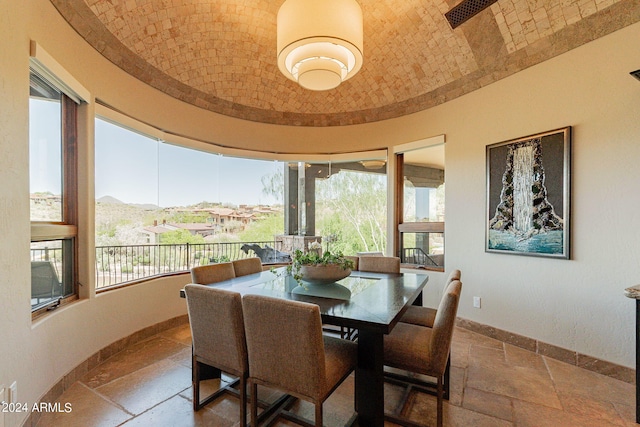 dining room with brick ceiling