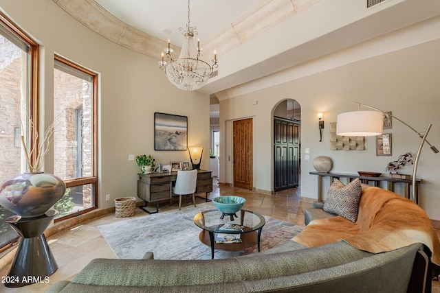 living room featuring a chandelier and plenty of natural light