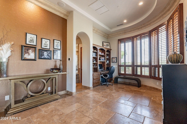 home office featuring built in desk, crown molding, and a tray ceiling