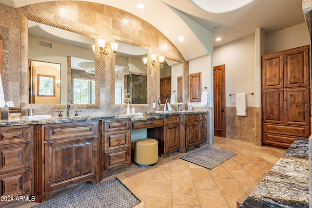 bathroom featuring tile walls and vanity