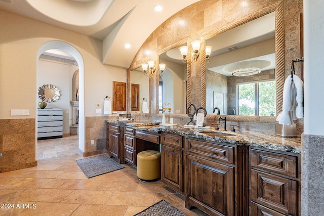 bathroom featuring tile walls and vanity