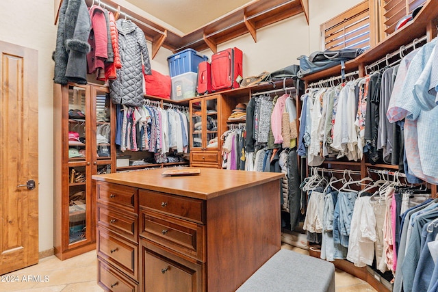 spacious closet with light tile patterned flooring