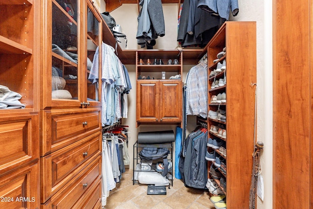 walk in closet featuring light tile patterned floors