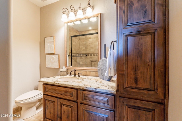 bathroom featuring walk in shower, vanity, and toilet