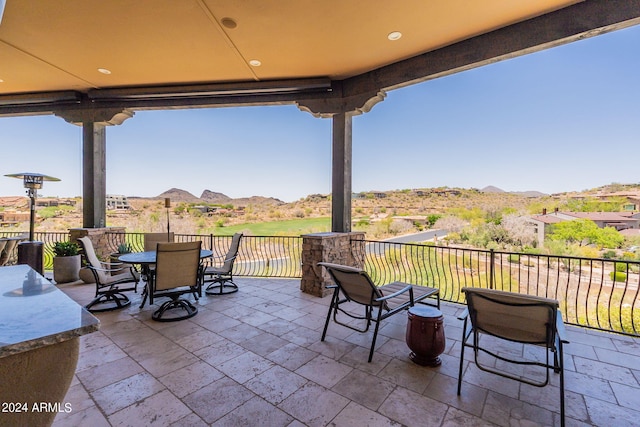 view of patio / terrace featuring a mountain view