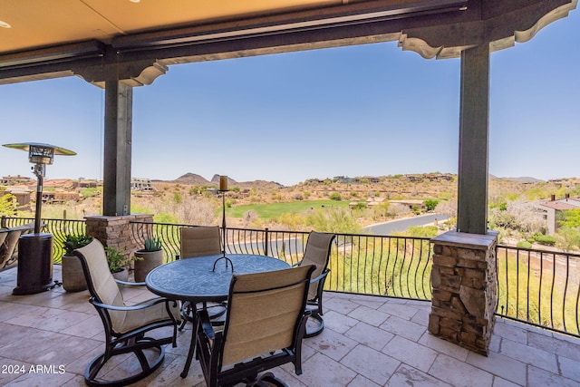 view of patio / terrace with a mountain view