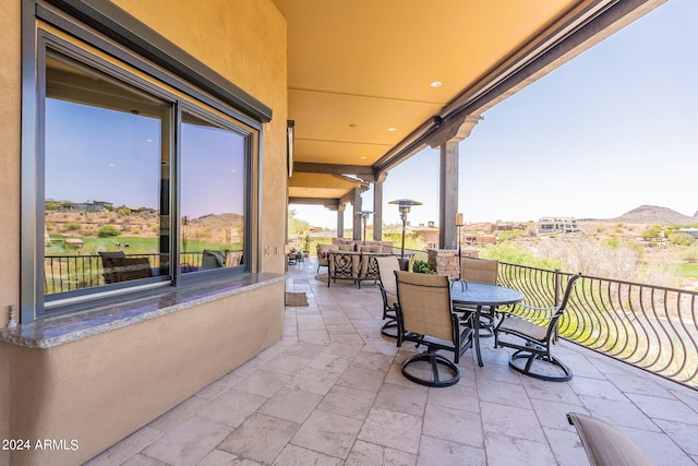 view of patio / terrace featuring a balcony and a mountain view