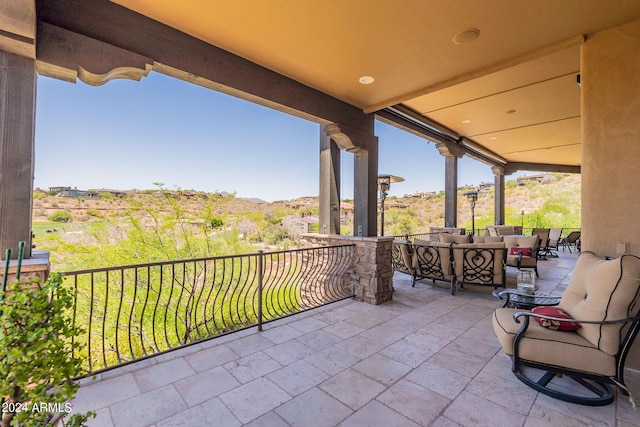 view of patio / terrace with a balcony