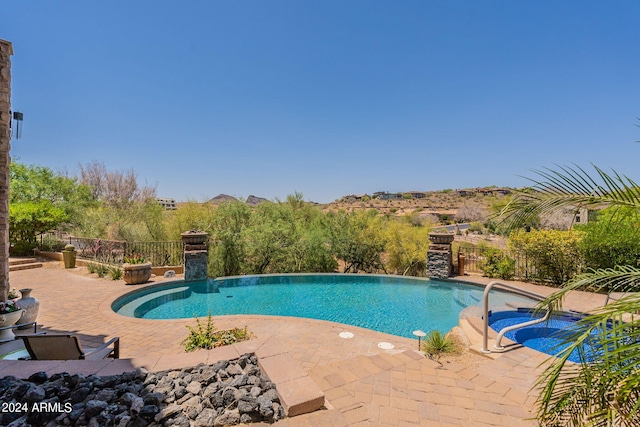 view of pool featuring a patio and pool water feature