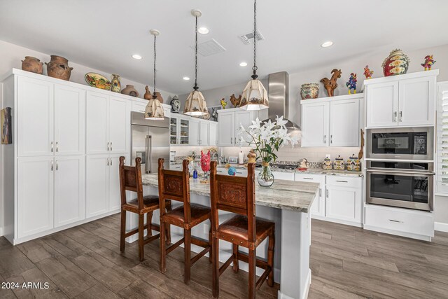 dining area with dark hardwood / wood-style flooring and a notable chandelier