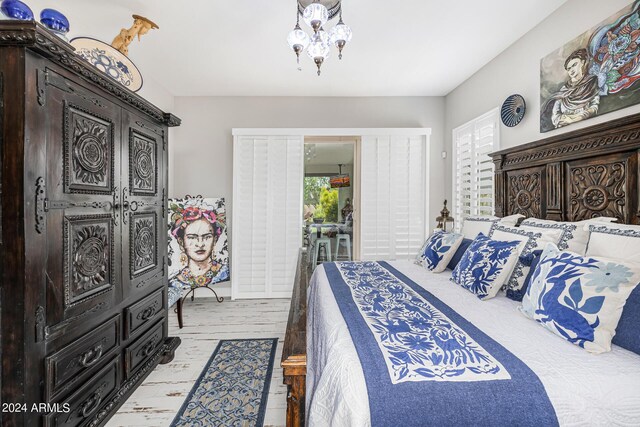 interior space featuring light stone counters, decorative backsplash, high end refrigerator, and white cabinetry