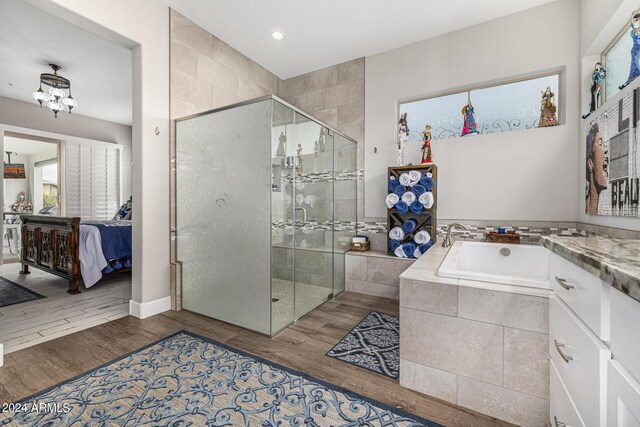 bathroom with hardwood / wood-style floors and toilet