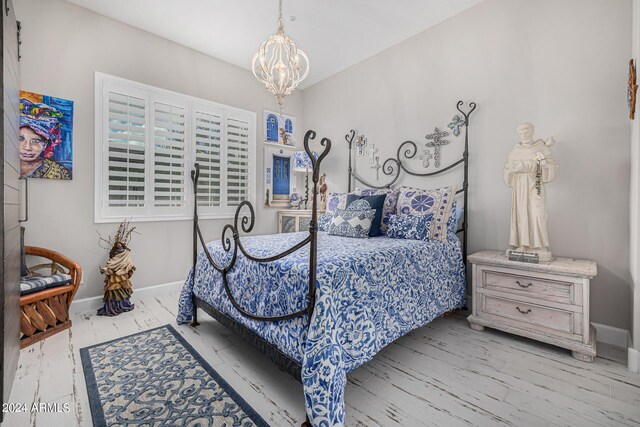 bedroom with light hardwood / wood-style flooring