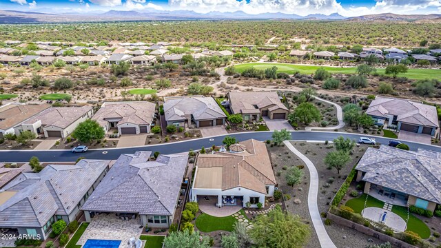 surrounding community featuring a lawn and a mountain view