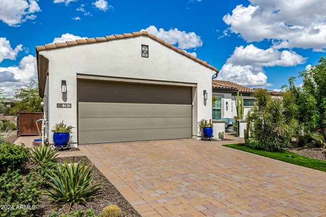 mediterranean / spanish-style home featuring a garage